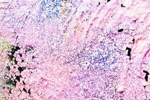 Fragment of colored graffiti painted on a wall. Bright abstract background for design. Spray pictures. photo