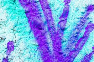Fragment of colored graffiti painted on a wall. Bright abstract background for design. Spray pictures. photo