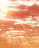 Sun rays breaking through cumulus clouds. The concept of divine light, a glimmer of hope or overcoming difficulties. Spiritual religious background. photo