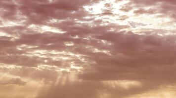 Sun rays breaking through cumulus clouds. The concept of divine light, a glimmer of hope or overcoming difficulties. Spiritual religious background. photo