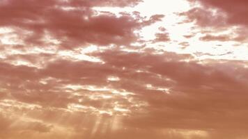 Sun rays breaking through cumulus clouds. The concept of divine light, a glimmer of hope or overcoming difficulties. Spiritual religious background. photo