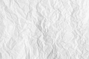 Texture of crumpled white parchment or paper. Abstract background for design. Blank with copy space. photo