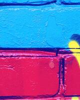 Fragment of colored graffiti painted on a wall. photo