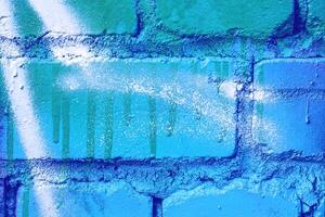 Fragment of colored graffiti painted on a wall. photo