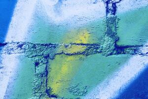 Fragment of colored graffiti painted on a wall. photo