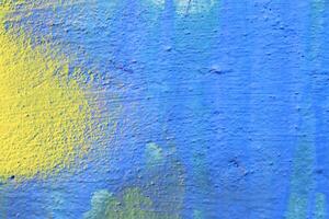 Fragment of colored graffiti painted on a wall. photo