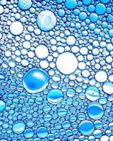 Top view on colorful drops of oil on the water. Circles and ovals. photo