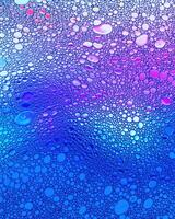 Top view on colorful drops of oil on the water. Circles and ovals. photo