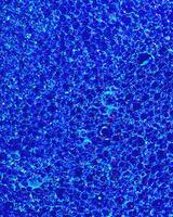Top view on colorful drops of oil on the water. Circles and ovals. photo