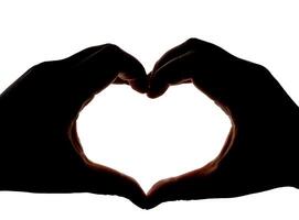 Silhouette of hands showing heart gesture isolated on white background. Blank for design. photo