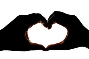 Silhouette of hands showing heart gesture isolated on white background. Blank for design. photo