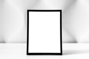 White wooden floor and black photo frame with copy space for a text background. Mock up.