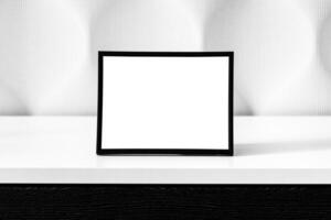 White wooden floor and black photo frame with copy space for a text background. Mock up.