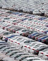 Volkswagen Group Rus, Russia, Kaluga - MAY 24, 2020 Rows of a new cars parked in a distribution center on a cloudy day in the spring, a car factory. Parking in the open air. photo