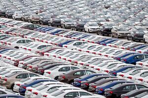 Volkswagen Group Rus, Russia, Kaluga - MAY 24, 2020 Rows of a new cars parked in a distribution center. Top view to the parking in the open air. photo