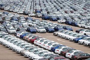 Volkswagen Group Rus, Russia, Kaluga - MAY 24, 2020 Rows of a new cars parked in a distribution center on a cloudy day in the spring, a car factory. Parking in the open air. photo
