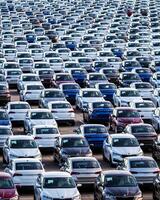 Volkswagen Group Rus, Russia, Kaluga - MAY 25, 2020 Rows of a new cars parked in a distribution center. Parking in the open air. photo