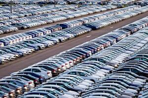 Volkswagen Group Rus, Russia, Kaluga - MAY 25, 2020 Rows of a new cars parked in a distribution center. Parking in the open air. photo