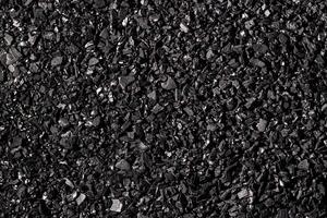 Close-up activated carbon texture. Coconut charcoal. photo