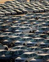 Russia, Kaluga - NOVEMBER 12, 2020 Rows of new cars parked in the parking lot of a factory or dealership. photo