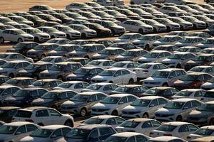Russia, Kaluga - NOVEMBER 12, 2020 Rows of new cars parked in the parking lot of a factory or dealership. photo