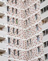 Fragment of the brick residential building with balconies. photo