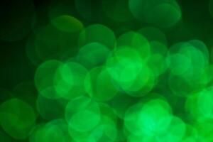Green lights abstract bokeh backdrop. Chrismas lights bokeh. photo