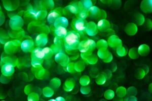 Green lights abstract bokeh backdrop. Chrismas lights bokeh. photo