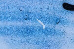 A fragment of colorful graffiti painted on a concrete wall. Abstract urban backdrop for design. photo
