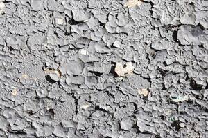 Texture of old white peeling paint on a concrete surface. Abstract backdrop for design. photo