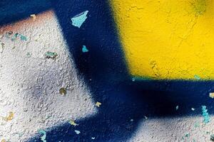 A fragment of colorful graffiti painted on a concrete wall. Abstract urban backdrop for design. photo