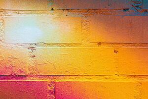 A fragment of colorful graffiti painted on a brick wall. Abstract backdrop for design. photo