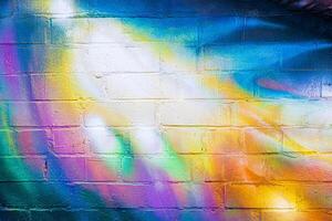 A fragment of colorful graffiti painted on a brick wall. Abstract backdrop for design. photo