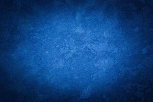 Blue decorative plaster texture with vignette. Abstract grunge background with copy space. photo