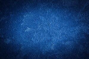 Blue decorative plaster texture with vignette. Abstract grunge background with copy space. photo