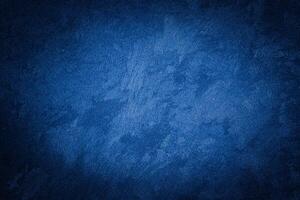 Blue decorative plaster texture with vignette. Abstract grunge background with copy space. photo