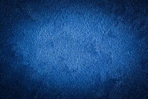 Blue decorative plaster texture with vignette. Abstract grunge background with copy space. photo