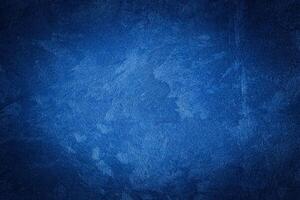 Blue decorative plaster texture with vignette. Abstract grunge background with copy space. photo