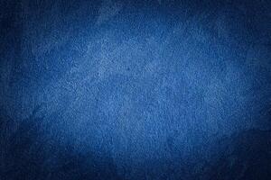 Blue decorative plaster texture with vignette. Abstract grunge background with copy space. photo