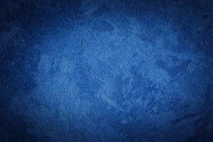Blue decorative plaster texture with vignette. Abstract grunge background with copy space. photo