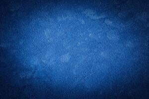 Blue decorative plaster texture with vignette. Abstract grunge background with copy space. photo
