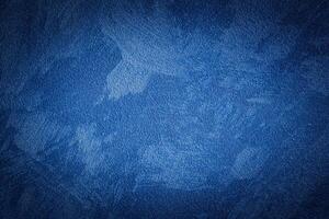 Blue decorative plaster texture with vignette. Abstract grunge background with copy space. photo
