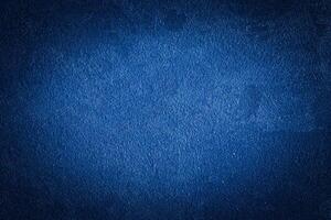 Blue decorative plaster texture with vignette. Abstract grunge background with copy space. photo