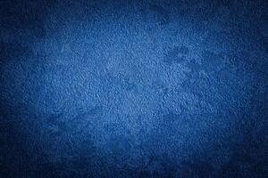Blue decorative plaster texture with vignette. Abstract grunge background with copy space. photo