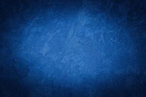 Blue decorative plaster texture with vignette. Abstract grunge background with copy space. photo