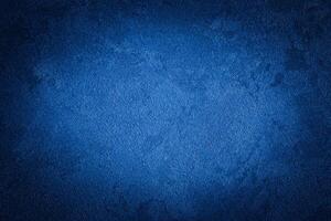 Blue decorative plaster texture with vignette. Abstract grunge background with copy space. photo