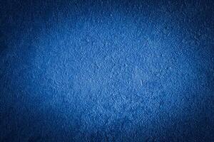 Blue decorative plaster texture with vignette. Abstract grunge background with copy space. photo