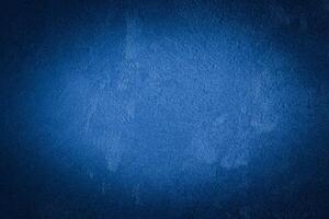 Blue decorative plaster texture with vignette. Abstract grunge background with copy space. photo