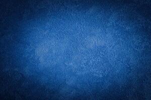 Blue decorative plaster texture with vignette. Abstract grunge background with copy space. photo