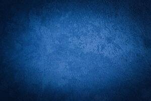 Blue decorative plaster texture with vignette. Abstract grunge background with copy space. photo